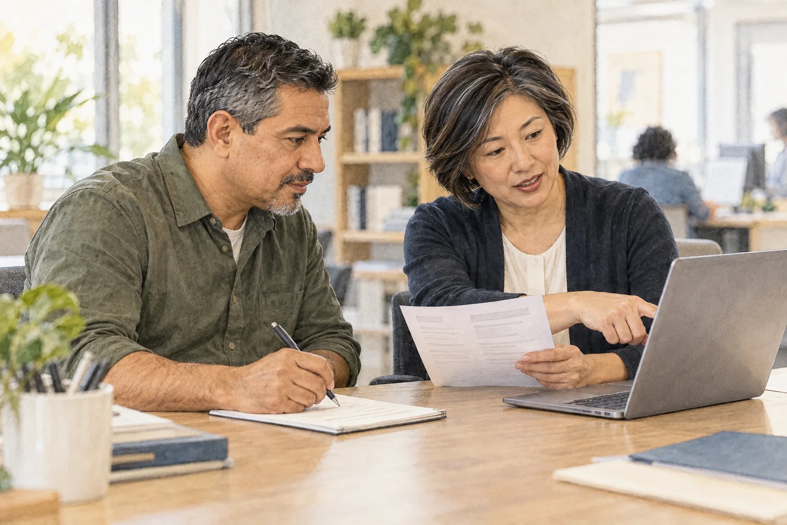 A job seeker works with a career counselor at a public workforce center